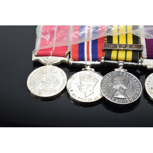 226 - A set of 4 miniature medals with ribbons to include Queen Elizabeth Kenya medal, QEII Regular Army m... 