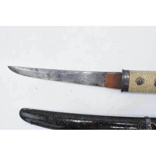 227 - A Japanese Tanto with shagreen handle and metal mounts. 29cm long. Length of blade 17cm.