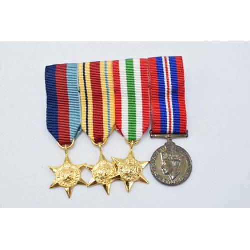 228 - A collection of World War II (WW2) medals to include The 1939-1945 Star, The Africa Star, The Italy ... 