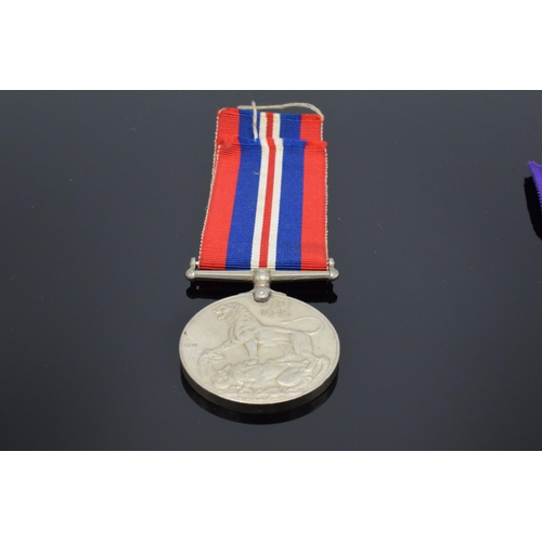 232 - A collection of militaria to include George VI silver Palestine 1945-48 medal and ribbon awarded to ... 