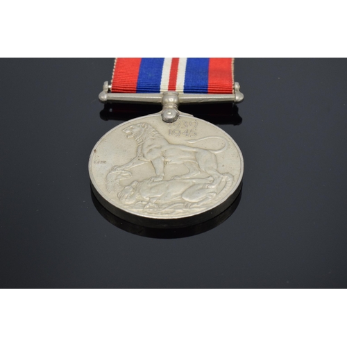 232 - A collection of militaria to include George VI silver Palestine 1945-48 medal and ribbon awarded to ... 