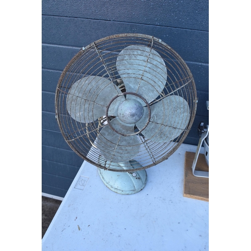 235 - A pair of items to include a vintage large industrial fan and a stage light which has been converted... 