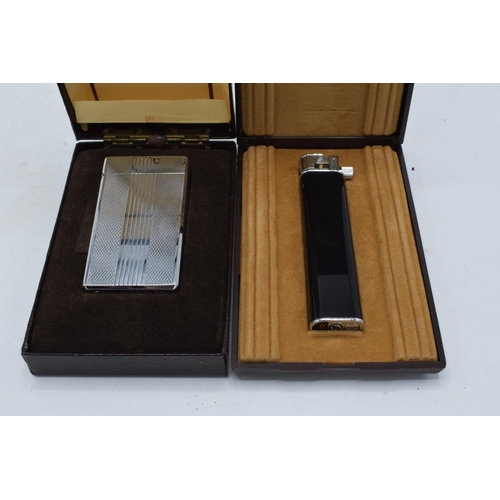 248 - A pair of cased Colibri cigaratte lighters to include a molectric and 1 similar (2).