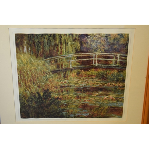 267 - A framed Claude Monet print of Waterlilies. 68 x 57cm inc frame.