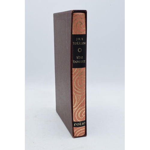 278 - A mixed collection of hardback books to include J R R Tolkien The Hobbit The Folio Society, The Wind... 