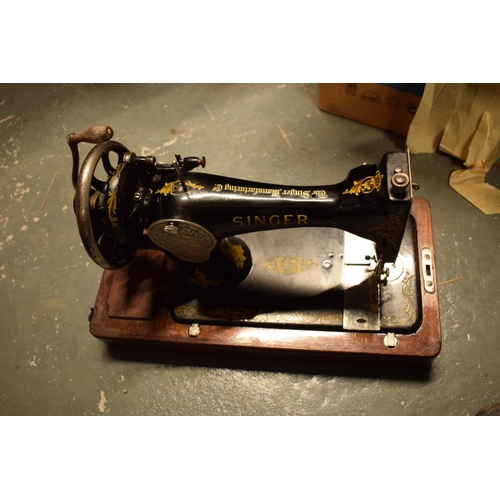 281 - A cased Singer sewing machine. Untested.