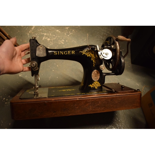 281 - A cased Singer sewing machine. Untested.