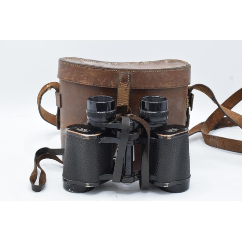 287 - A cased pair of Carl Zeiss Jena Deltrintem 8 x 30 binoculars with leather carry case. With wear and ... 