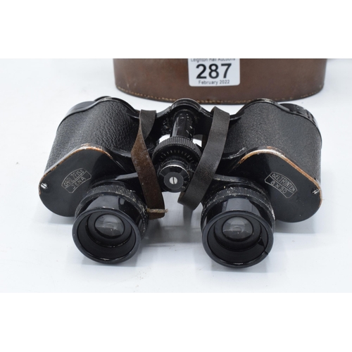 287 - A cased pair of Carl Zeiss Jena Deltrintem 8 x 30 binoculars with leather carry case. With wear and ... 