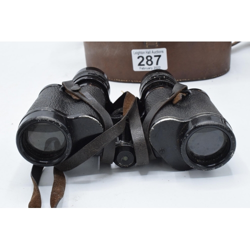 287 - A cased pair of Carl Zeiss Jena Deltrintem 8 x 30 binoculars with leather carry case. With wear and ... 