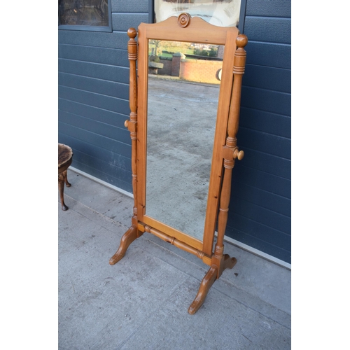 312 - A 20th century pine free-standing full length mirror. 151cm tall.