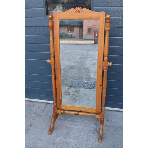 312 - A 20th century pine free-standing full length mirror. 151cm tall.