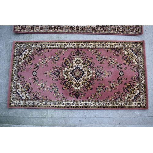 313 - A pair of similar Grosvenor Worsted Wilton Persian reproduction rugs. Both appear to be in good cond... 