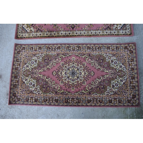 313 - A pair of similar Grosvenor Worsted Wilton Persian reproduction rugs. Both appear to be in good cond... 