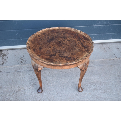 314 - A 20th century Georgian style walnut circular table, quarter-veneered pie-crust top and cabriole leg... 