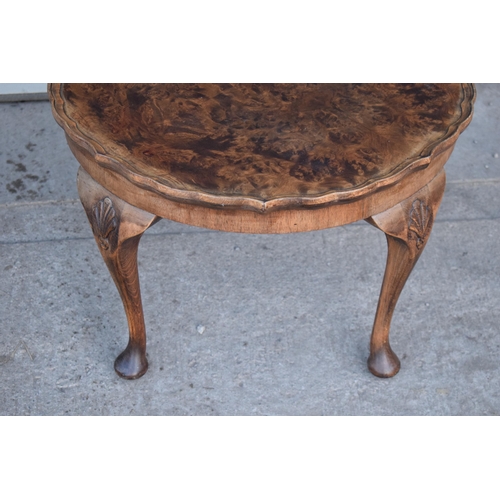 314 - A 20th century Georgian style walnut circular table, quarter-veneered pie-crust top and cabriole leg... 