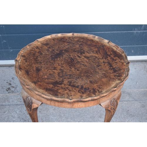 314 - A 20th century Georgian style walnut circular table, quarter-veneered pie-crust top and cabriole leg... 