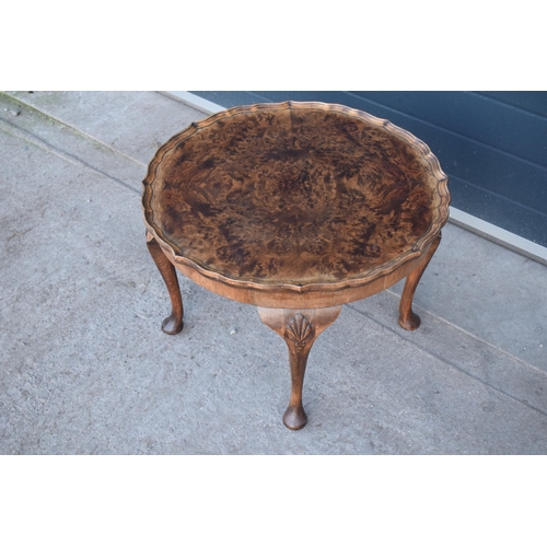 314 - A 20th century Georgian style walnut circular table, quarter-veneered pie-crust top and cabriole leg... 