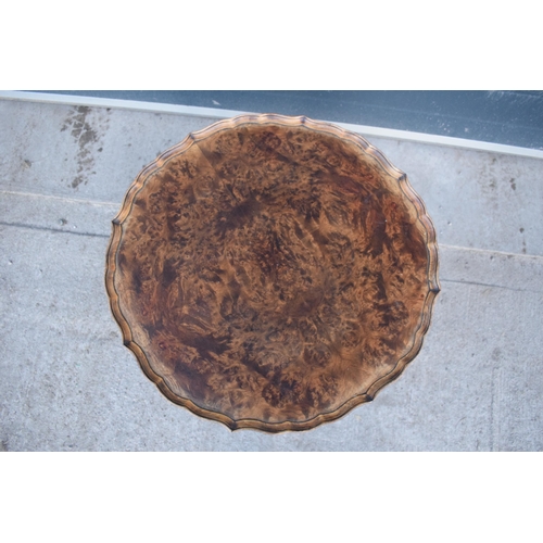 314 - A 20th century Georgian style walnut circular table, quarter-veneered pie-crust top and cabriole leg... 