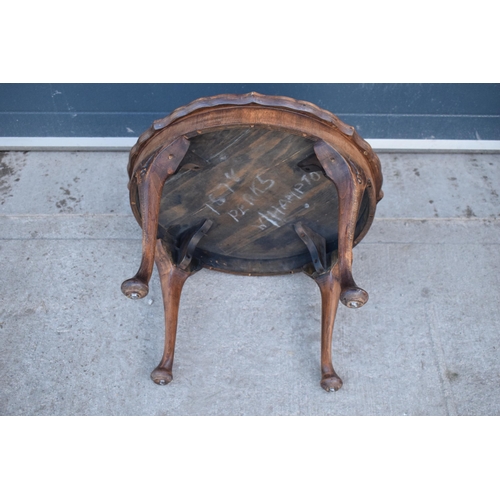 314 - A 20th century Georgian style walnut circular table, quarter-veneered pie-crust top and cabriole leg... 