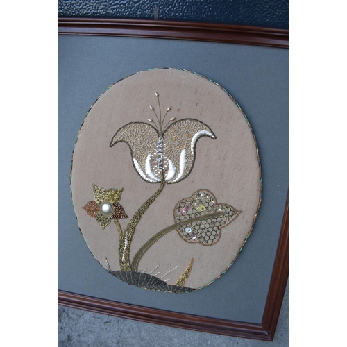 315 - A heavy and painted 20th century brass mirror / fire screen together with an embroidered wall hangin... 