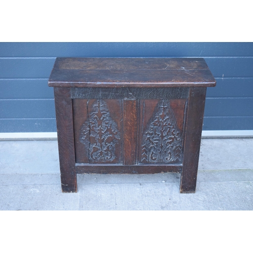 321 - An 18th century thick oak carved chest with fold up lift and iron hinges. 71 x 30 x 61cm tall. Consi... 