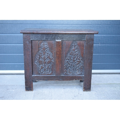 321 - An 18th century thick oak carved chest with fold up lift and iron hinges. 71 x 30 x 61cm tall. Consi... 