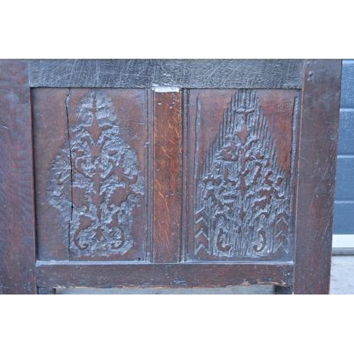 321 - An 18th century thick oak carved chest with fold up lift and iron hinges. 71 x 30 x 61cm tall. Consi... 