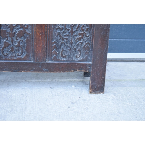 321 - An 18th century thick oak carved chest with fold up lift and iron hinges. 71 x 30 x 61cm tall. Consi... 