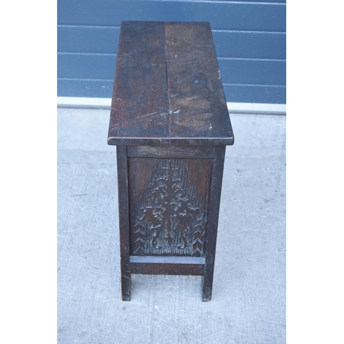 321 - An 18th century thick oak carved chest with fold up lift and iron hinges. 71 x 30 x 61cm tall. Consi... 