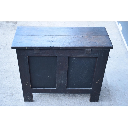 321 - An 18th century thick oak carved chest with fold up lift and iron hinges. 71 x 30 x 61cm tall. Consi... 