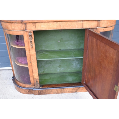 322 - A Victorian walnut breakfront credenza with an inlaid panel door flanked by bow glass doors enclosin... 