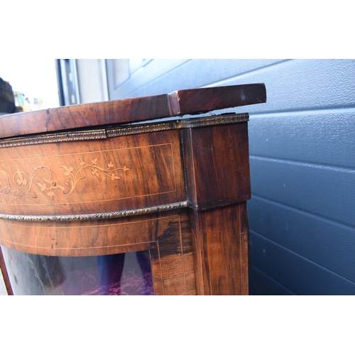 322 - A Victorian walnut breakfront credenza with an inlaid panel door flanked by bow glass doors enclosin... 