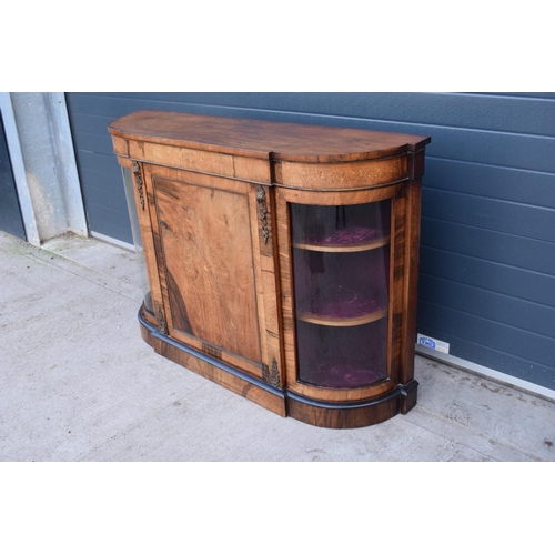 322 - A Victorian walnut breakfront credenza with an inlaid panel door flanked by bow glass doors enclosin... 