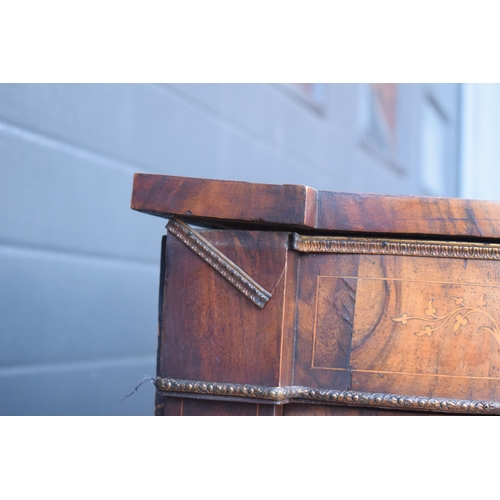 322 - A Victorian walnut breakfront credenza with an inlaid panel door flanked by bow glass doors enclosin... 