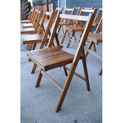 325 - A collection of 14 early to mid 20th century folding wooden chapel chairs (14). In good functional c... 