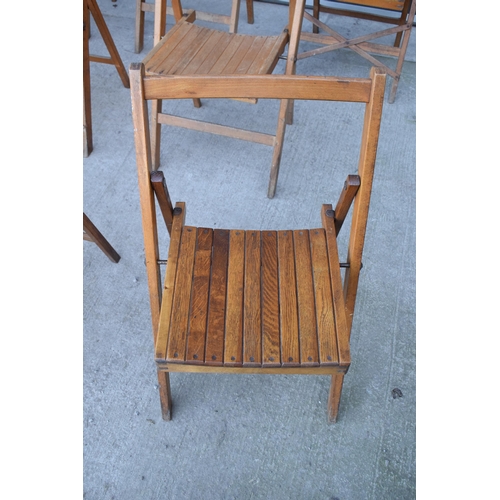 325 - A collection of 14 early to mid 20th century folding wooden chapel chairs (14). In good functional c... 