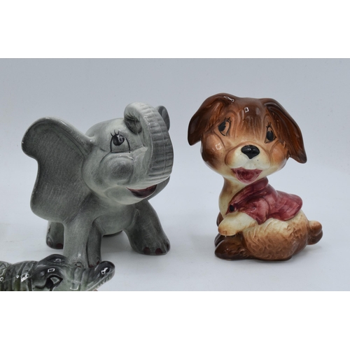 40 - A collection of comical Weatherby pottery Zookie figures to include a lamb, toucan, a puppy, an elep... 