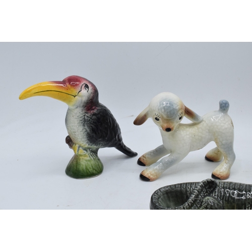 40 - A collection of comical Weatherby pottery Zookie figures to include a lamb, toucan, a puppy, an elep... 