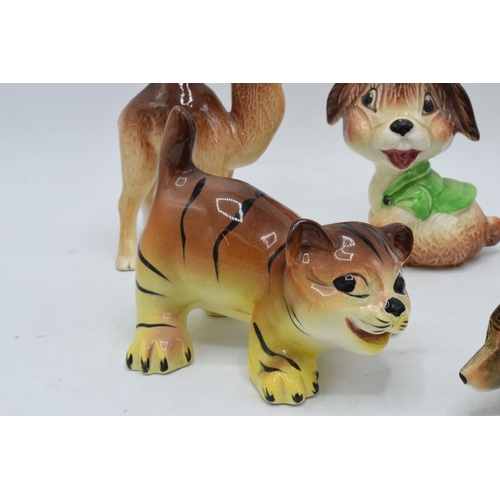 41 - A collection of comical Weatherby pottery Zookie figures to include a sausage dog, a puppy, a foal, ... 