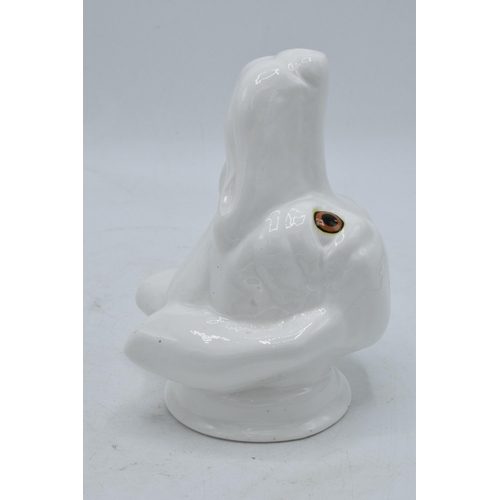 63 - James Kent Old Foley fine bone china stirrup cup in the form of a dog's head in a white glaze. In go... 