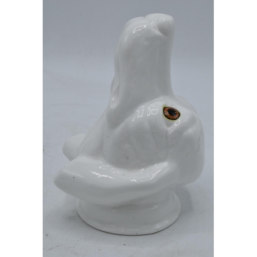 63 - James Kent Old Foley fine bone china stirrup cup in the form of a dog's head in a white glaze. In go... 