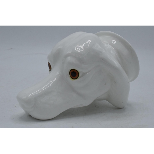 63 - James Kent Old Foley fine bone china stirrup cup in the form of a dog's head in a white glaze. In go... 