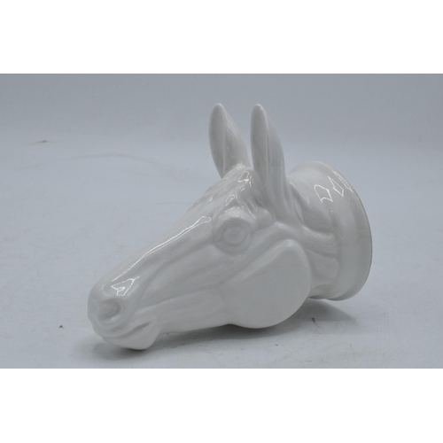 64 - James Kent Old Foley fine bone china stirrup cup in the form of a horse's head in a white glaze. In ... 