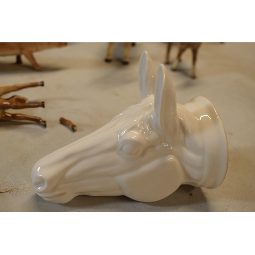 64 - James Kent Old Foley fine bone china stirrup cup in the form of a horse's head in a white glaze. In ... 