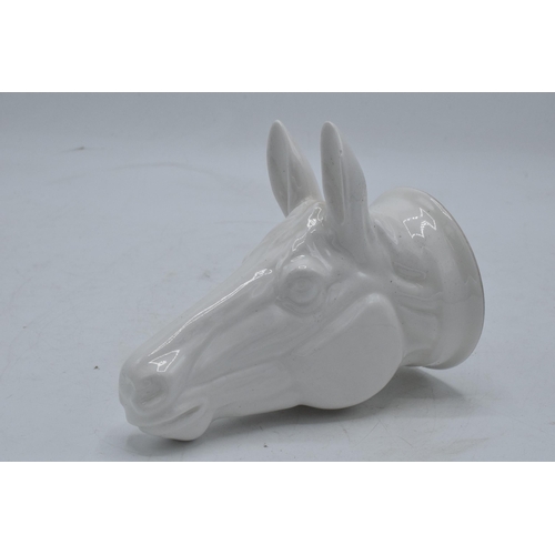 65 - James Kent Old Foley fine bone china stirrup cup in the form of a horse's head in a white glaze. In ... 