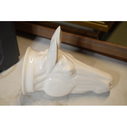 65 - James Kent Old Foley fine bone china stirrup cup in the form of a horse's head in a white glaze. In ... 