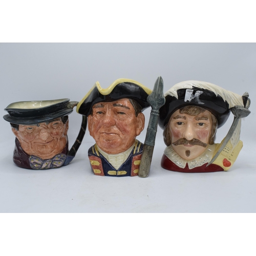 67 - A trio of large Royal Doulton character jugs to include Guardsman D6568, Tony Weller and Cyrano de B... 