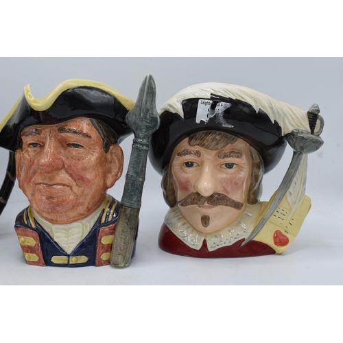 67 - A trio of large Royal Doulton character jugs to include Guardsman D6568, Tony Weller and Cyrano de B... 