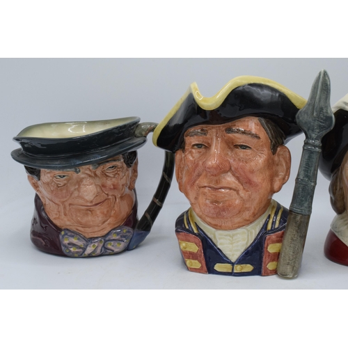 67 - A trio of large Royal Doulton character jugs to include Guardsman D6568, Tony Weller and Cyrano de B... 